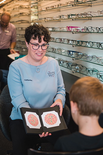 Behavioural Optometrist testing child's colour vision