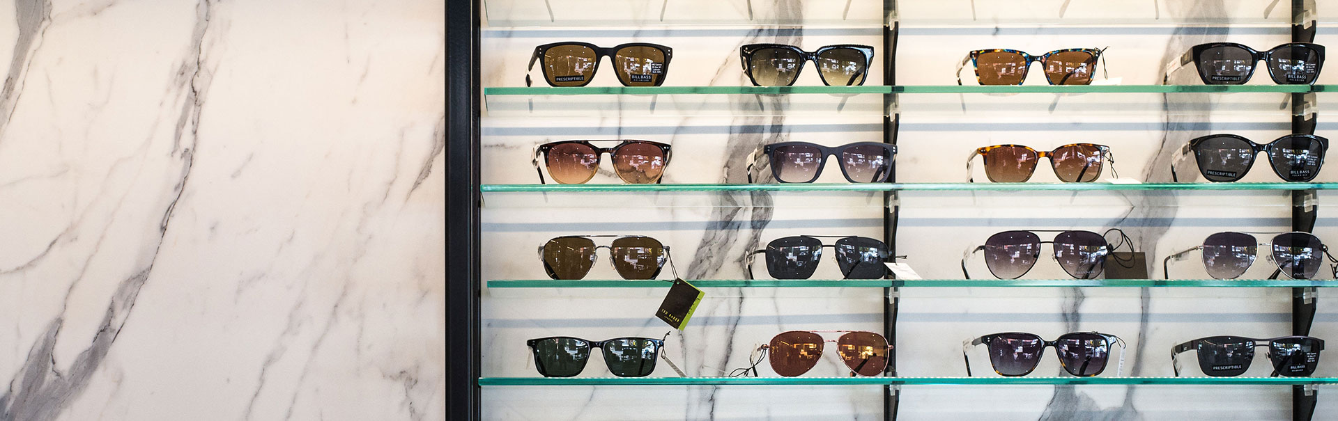Glass shelves with sunglasses on display